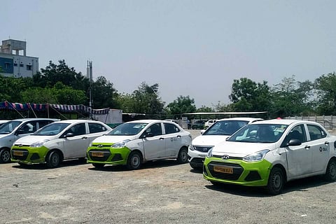 Ola cabs parked in a parking slot