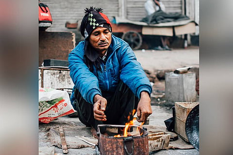 Man warming himself