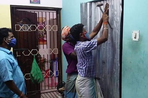 The workers are harming the home of a COVID-19 recovered patient in Pallavaram