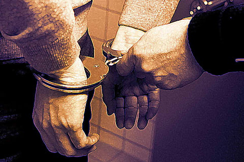 Police arresting man