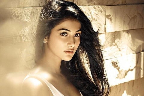 Pooja Hegde is seen sporting a casual look in a white tee.