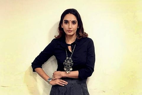 Actor Ragini Dwivedi posing for a photo