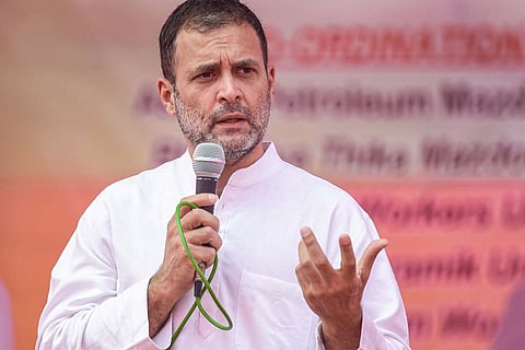 Congress Leader Rahul Gandhi speaking holding a mike 