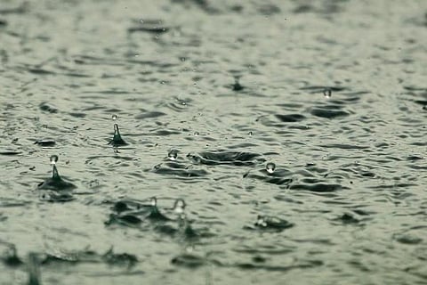 Rainfall over a pool of water
