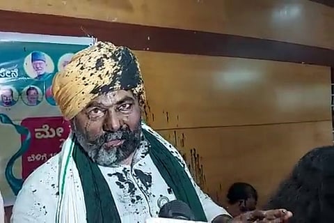 Farmer leader Rakesh Tikait after ink was thrown at him at a press meet in Bengaluru