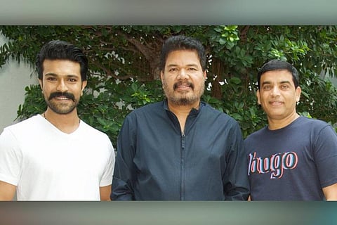 Actor Ram Charan, director Shankar and producer Dil Raju. 