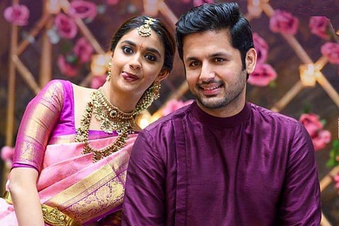 Keerthy Suresh is seen donning a pink bridal saree, while Nithiin is seen in a purple Kurta in the image.