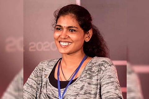 Rehana Fathima smiling looking forwards towards the left