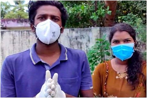 Kerala Covid-19 volunteers Rekha and Aswin, Aswin in blue t shirt and Rekha in yellow kurta, both wearing mask 