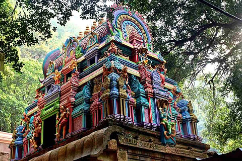 Representational image for a temple showing a temple tower with colourful sculptures