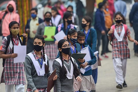 An image if school students walking in Delhi