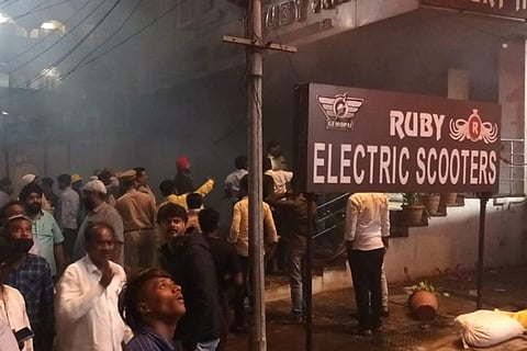 People gathered outside Ruby Hotel, Secunderabad, where a fire broke out