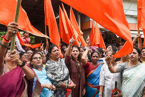 Shiv Sena workers backing Uddhav Thackeray stage a protest in Mumbai amid the rebellion by MLA Eknath Shinde