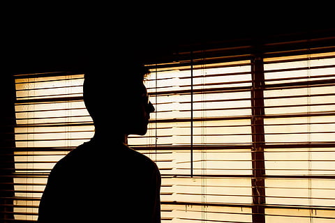 Representative image of a silhouette of a man against a window