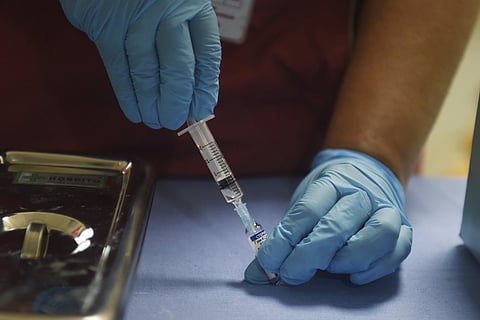 A representational image of a vaccine being administered
