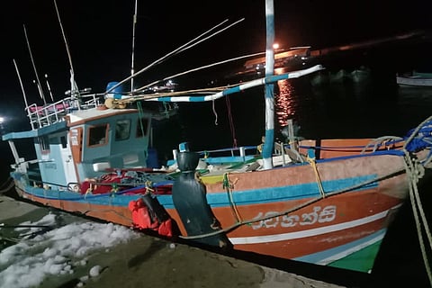 Fishing boat docked on a fishing harbour 