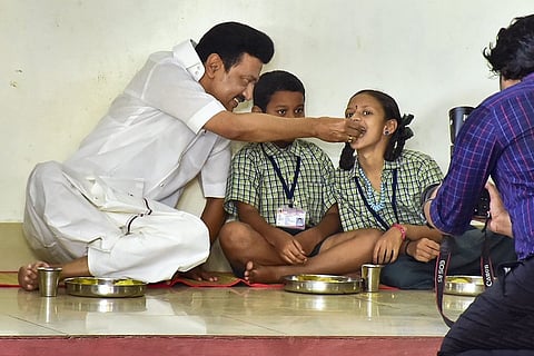 Stalin having meals with kids at the Aadhimoolam Corporation Primary School in Madurai