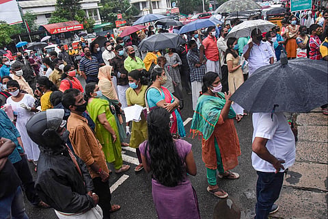 File image of Students standing in queue at a NEET exam centre