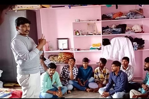 Telangana lawyer Subbarao explaining about cases at an awareness campaign in a village