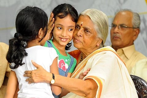 Sugathakumari with two little girls
