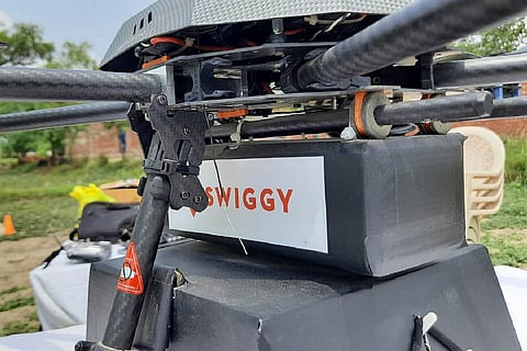 A drone with Swiggy logo