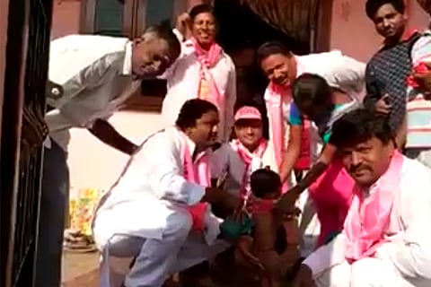 TRS man washes baby's bum to campaign for votes: No, we're not kidding
