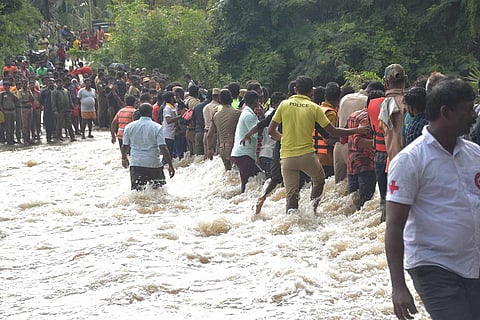 Tirunelveli: Devotees who came to offer prayers at Nambi temple being rescued from a flood affected area following heavy rain in Tirunelveli, Saturday, Oct. 16, 2021.
