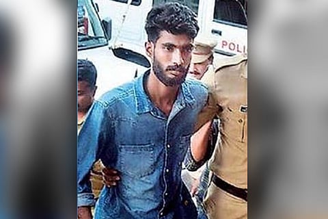 Thaha Fasal, who was arrested along with Alan Suhaib, in Kerala UAPA Case coming out of a court accompanied by the police