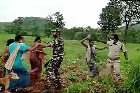 Tribal women clashing with forest officials 