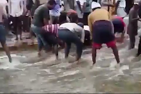 Video: Rains leave Bengaluru roads jammed, and people are fishing on the streets