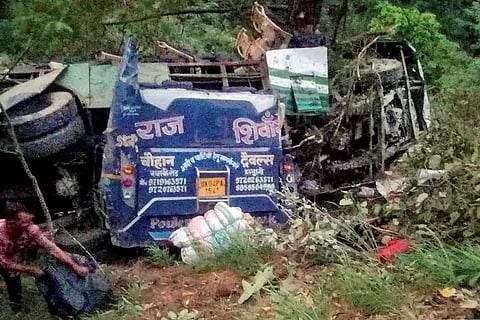 Accident site in Uttarakhand, overturned bus visible