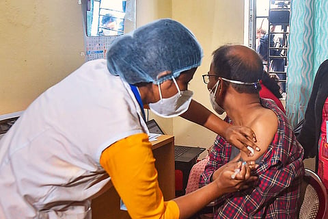 A file image of a man getting vaccinated