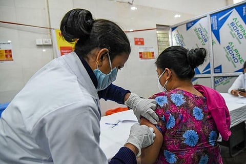 A woman getting vaccinated