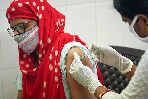 Representational image of woman taking a vaccine