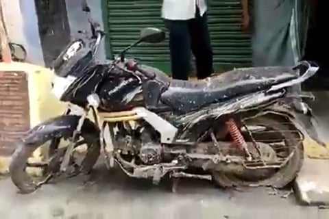 The bike, seen stuck in the newly-laid road in Vellore in Tamil Nadu