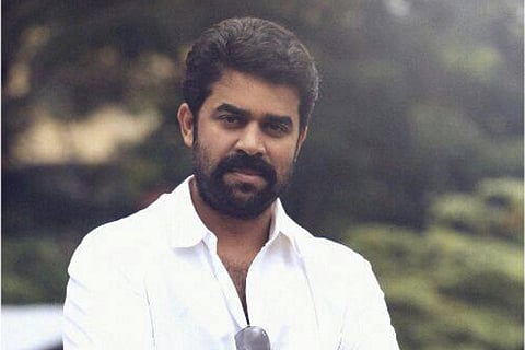 File image of actor producer Vijay Babu wearing a white shirt