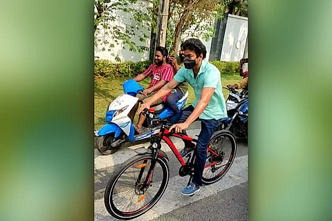 Vijay riding bicycle