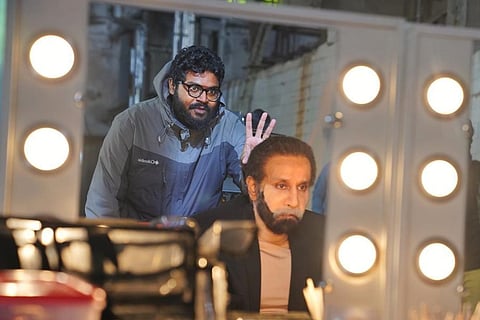 Vikram is seen in a new look alongside director Ajay Gnanumuthu