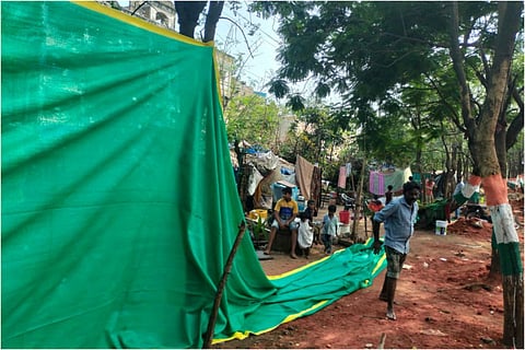 Shade nets put up to cover slum areas in Vizag
