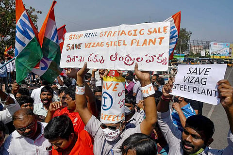 Vizag Steel Plant employees and trade union members stage a protest against the central government's decision of privatization of the Rashtriya Ispat Nigam Limited (RINL)