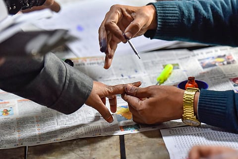 File photo of a citizen getting inked after voting