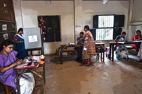 Voters standing inside polling station