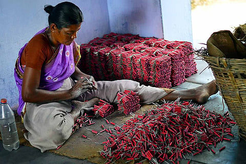 Woman employee at firecracker unit