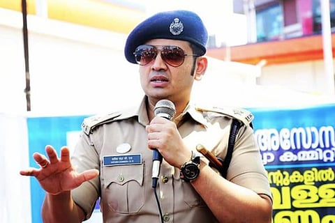 Yathish chandra wearing shades and in police uniform 