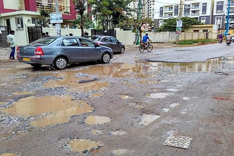 Bengaluru road riddled with potholes