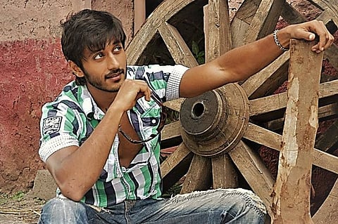 Actor Chetan posing for a shot