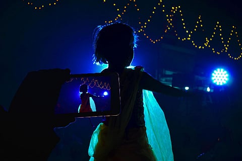 Representational image of a child's dance video being recorded