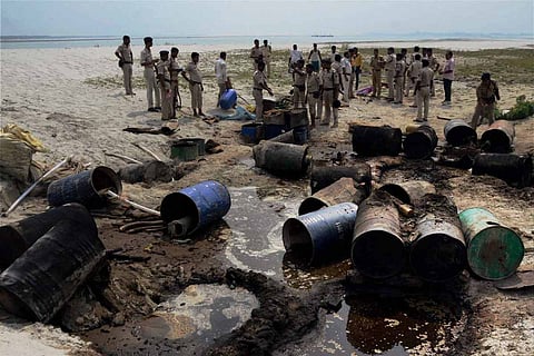 Representative image of police destroying country-made liquor