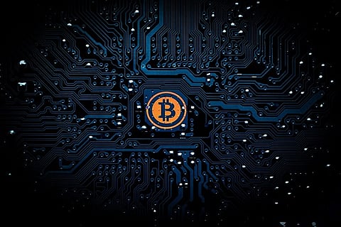 Bitcoin slides by over $1,000 amid controversy over future of digital currency