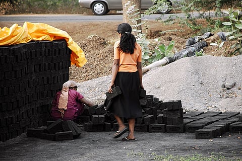 Representative image of labourers working at a brick factory